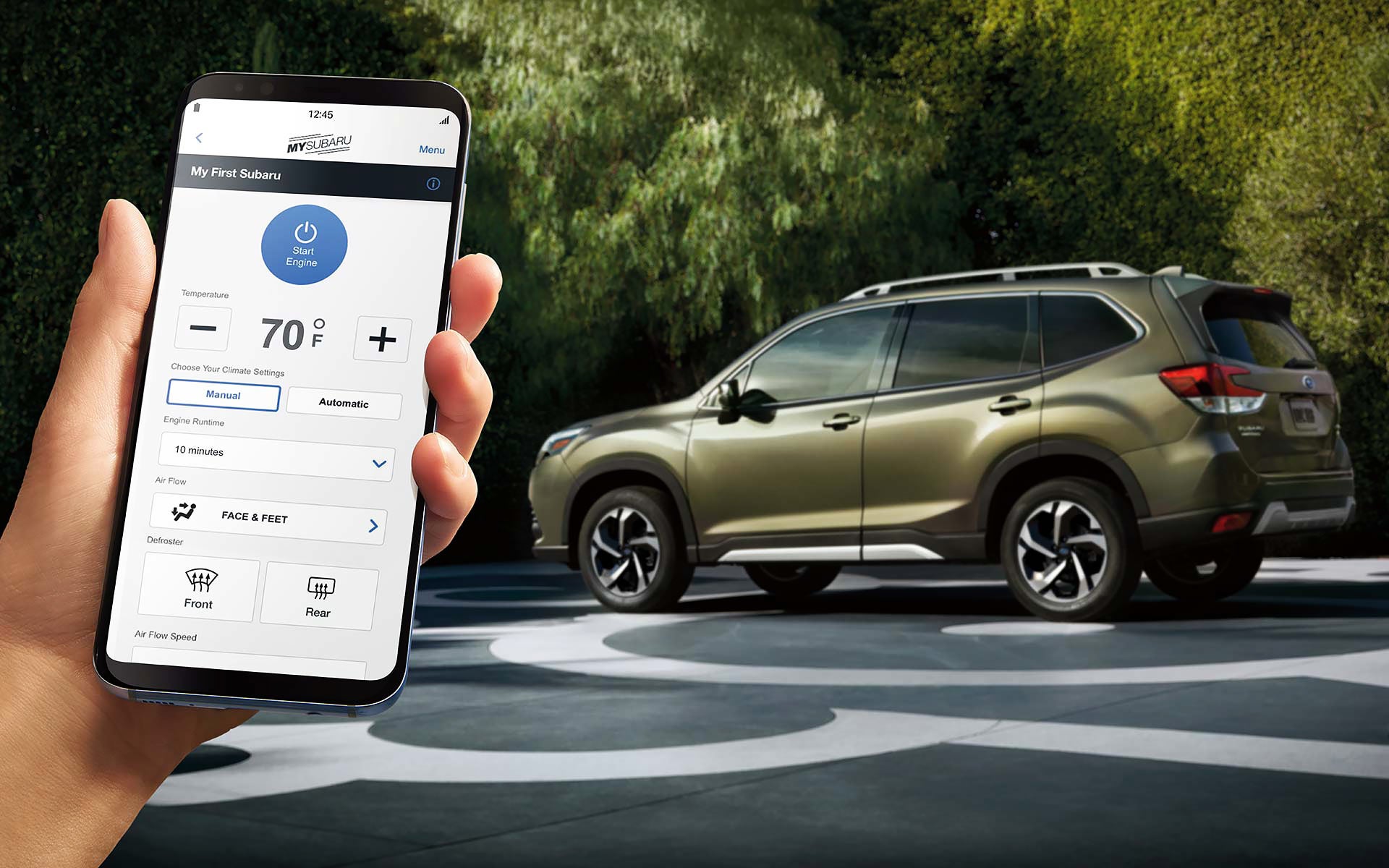 A close-up of a phone showing the Remote Engine Start with Climate Control feature of SUBARU STARLINK® Safety and Security available on the 2022 Forester. | Vann York Subaru in Asheboro NC
