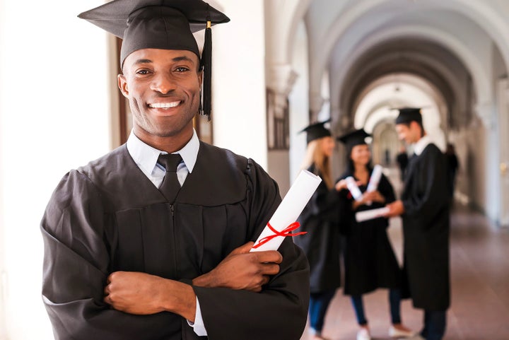 college graduate holding his diploma | Vann York Subaru in Asheboro NC