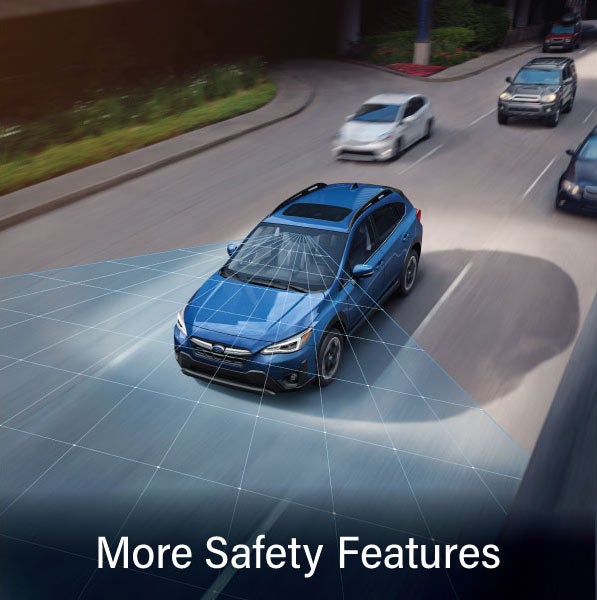 A Subaru Crosstrek in blue with the words &ldquo;More Safety Features&ldquo;. | Vann York Subaru in Asheboro NC
